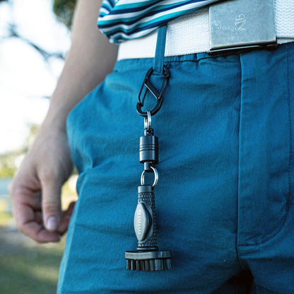 Person wearing blue pants with a miniG golf brush attached to their belt - Grooveit miniG – Compact Dry Golf Brush - Grooveit "The Wet Club Scrub" - #golf_club_cleaner# - #golf_club_brush# - #golf_brush# - #grooveit# - #groove_it_brush# - #grooveit_brush# - #groove_cleaner# - #golf_club_cleaning_brush# - #go